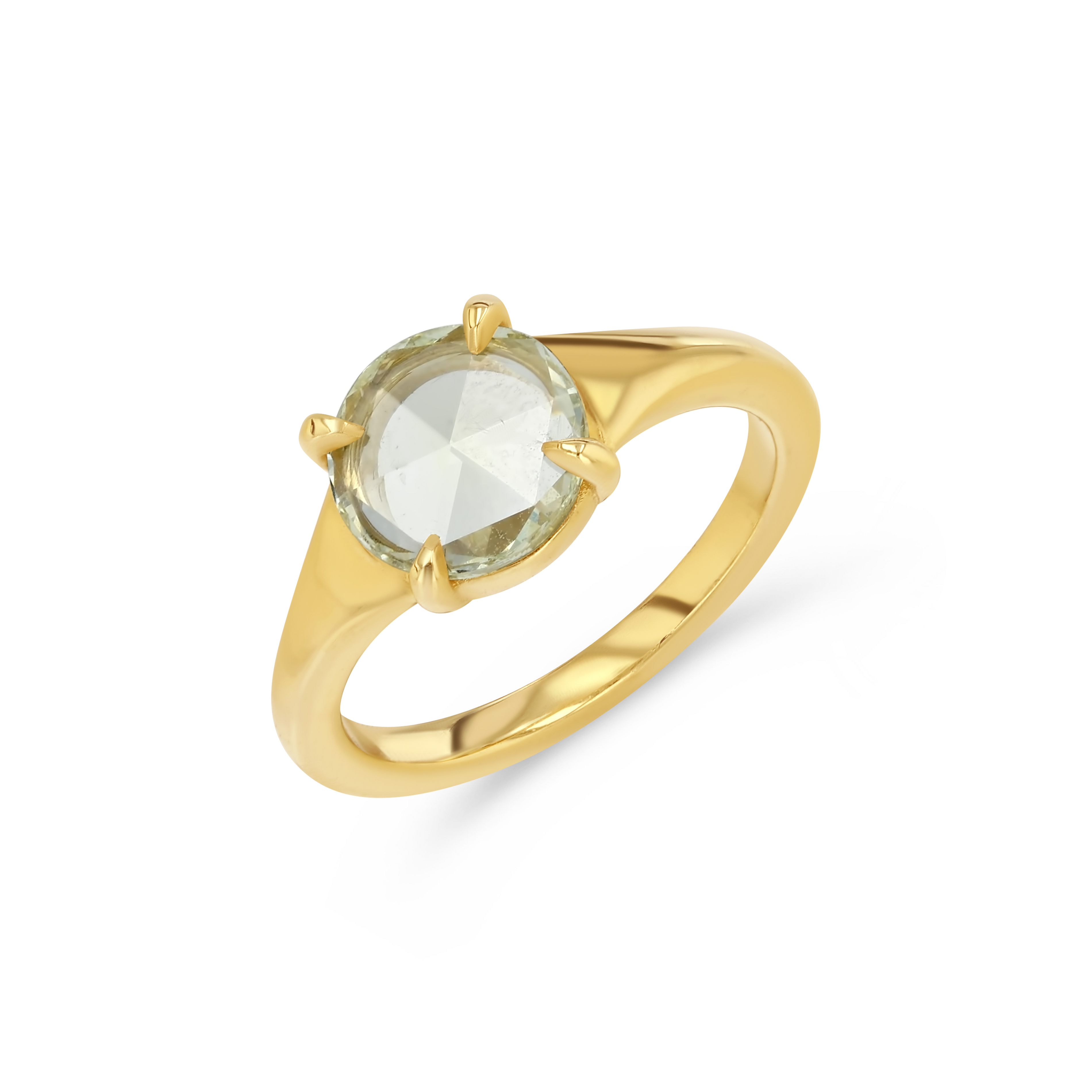 Gold ring with a green gemstone on a white background