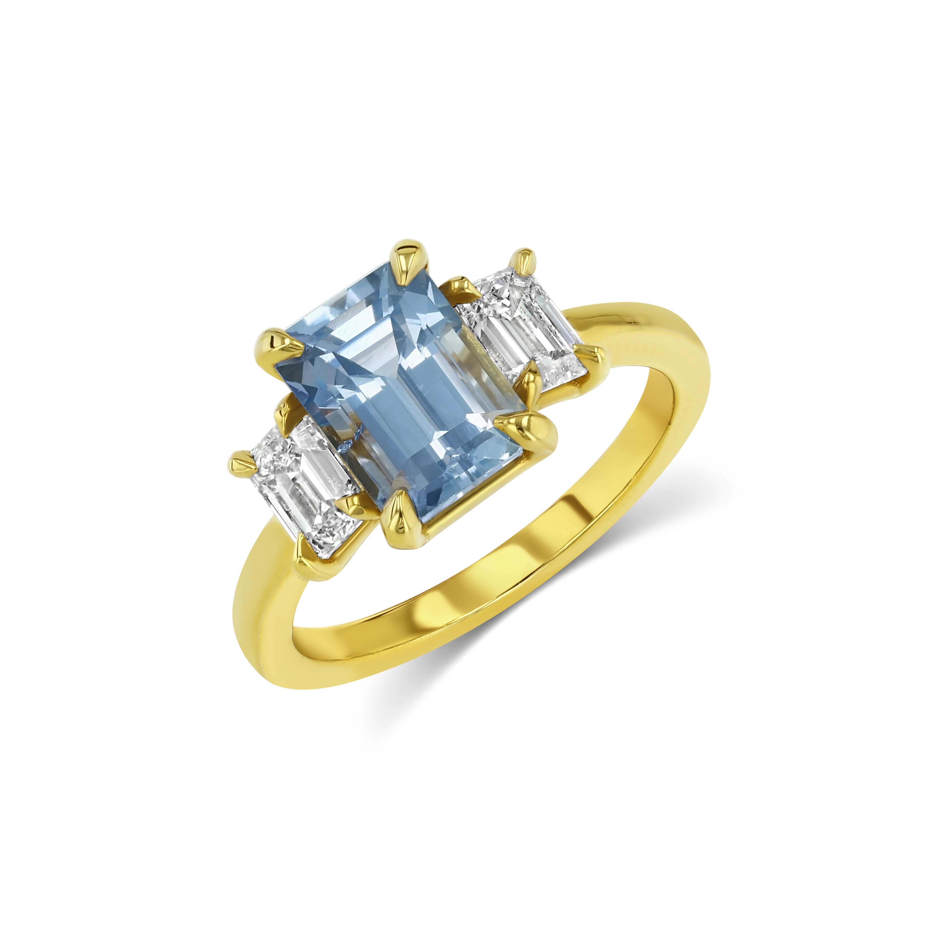 Gold ring with a blue gemstone and smaller diamonds on a white background