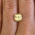 Yellow sapphire gemstone on a hand