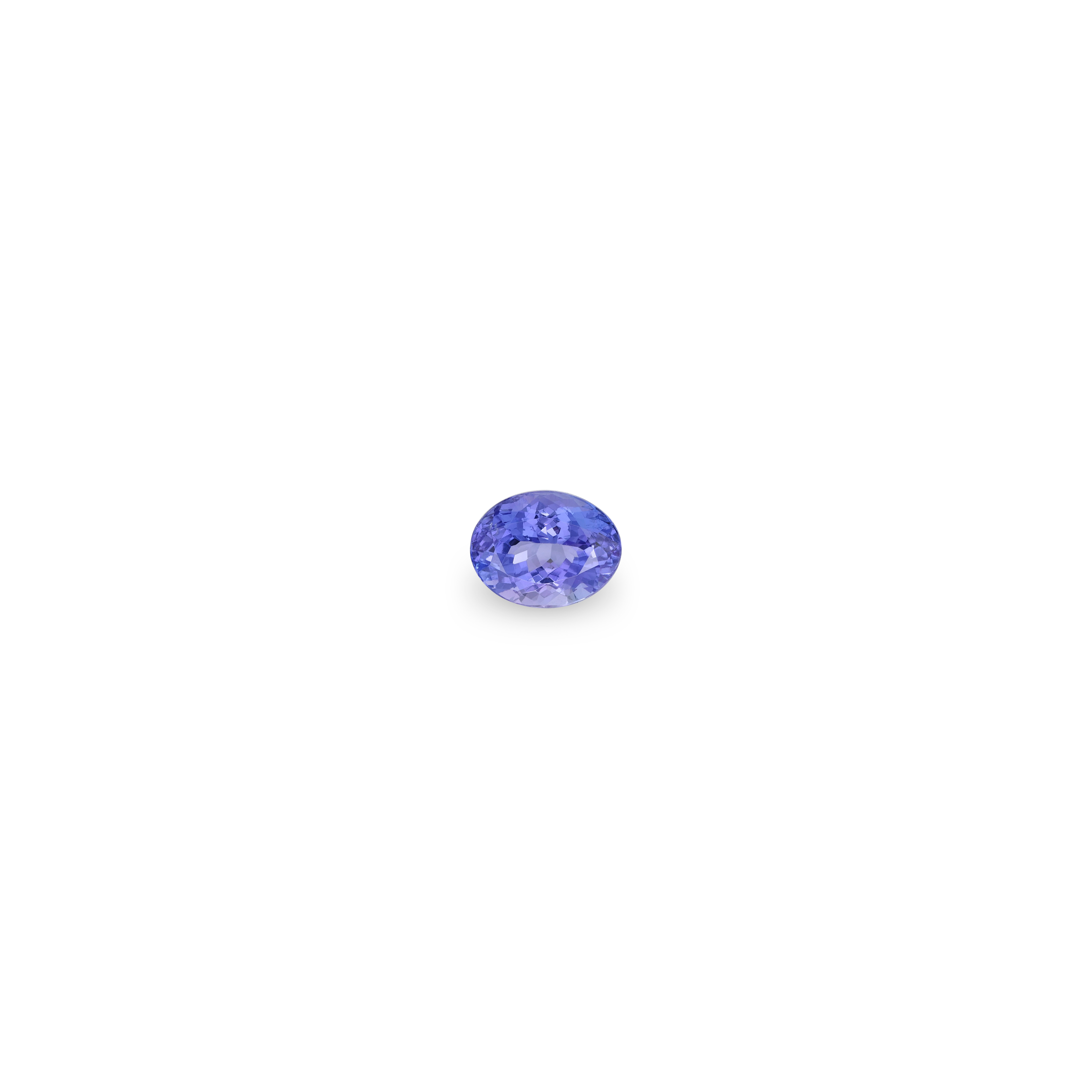 A single oval-cut tanzanite gemstone with a vibrant periwinkle blue color, centered on a solid white background.
