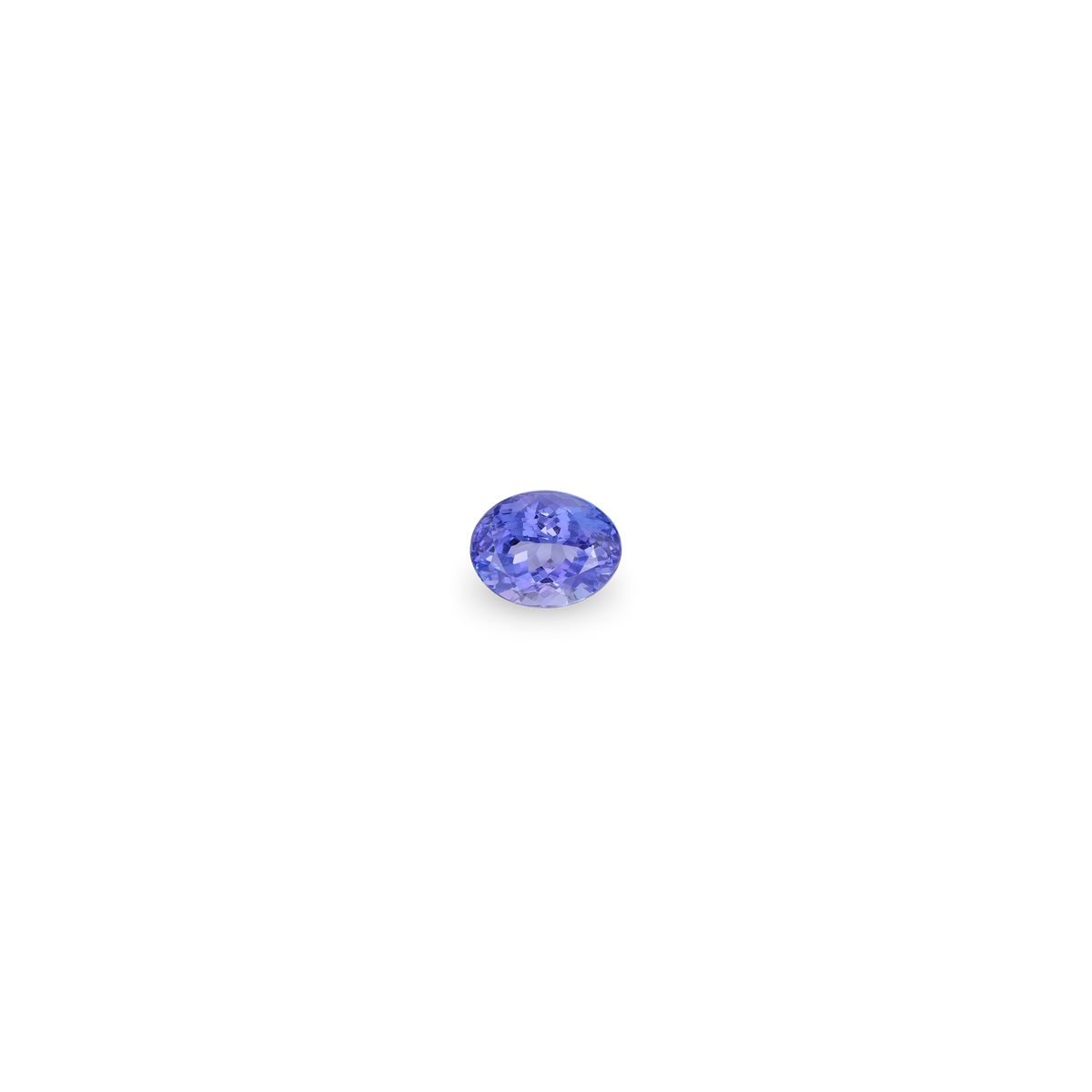 A single oval-cut tanzanite gemstone with a vibrant periwinkle blue color, centered on a solid white background.