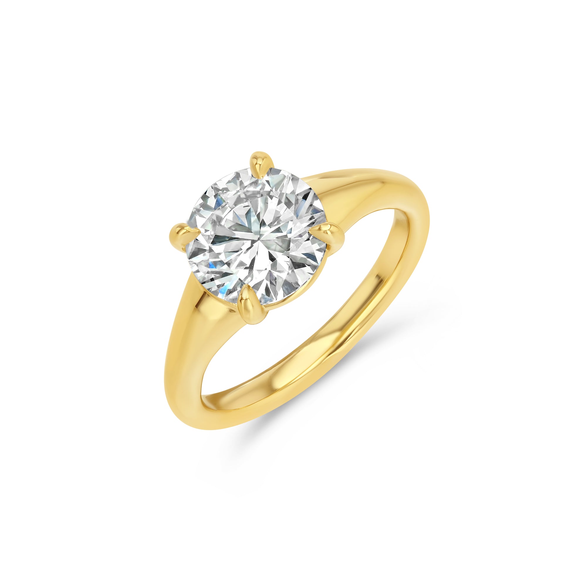 Gold ring with a large diamond on a white background