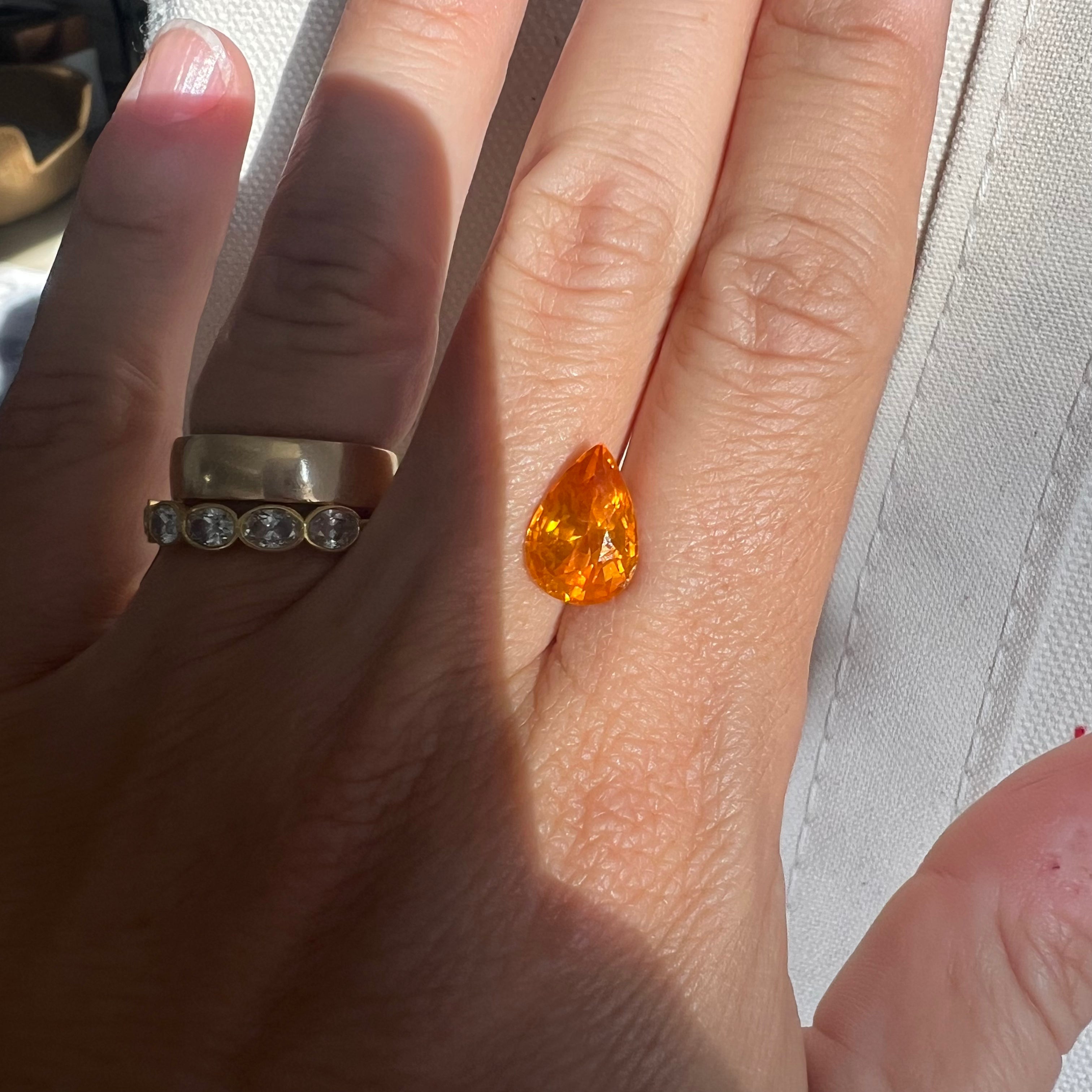 BESPOKE 5.21CT YELLOWISH-ORANGE PEAR SAPPHIRE