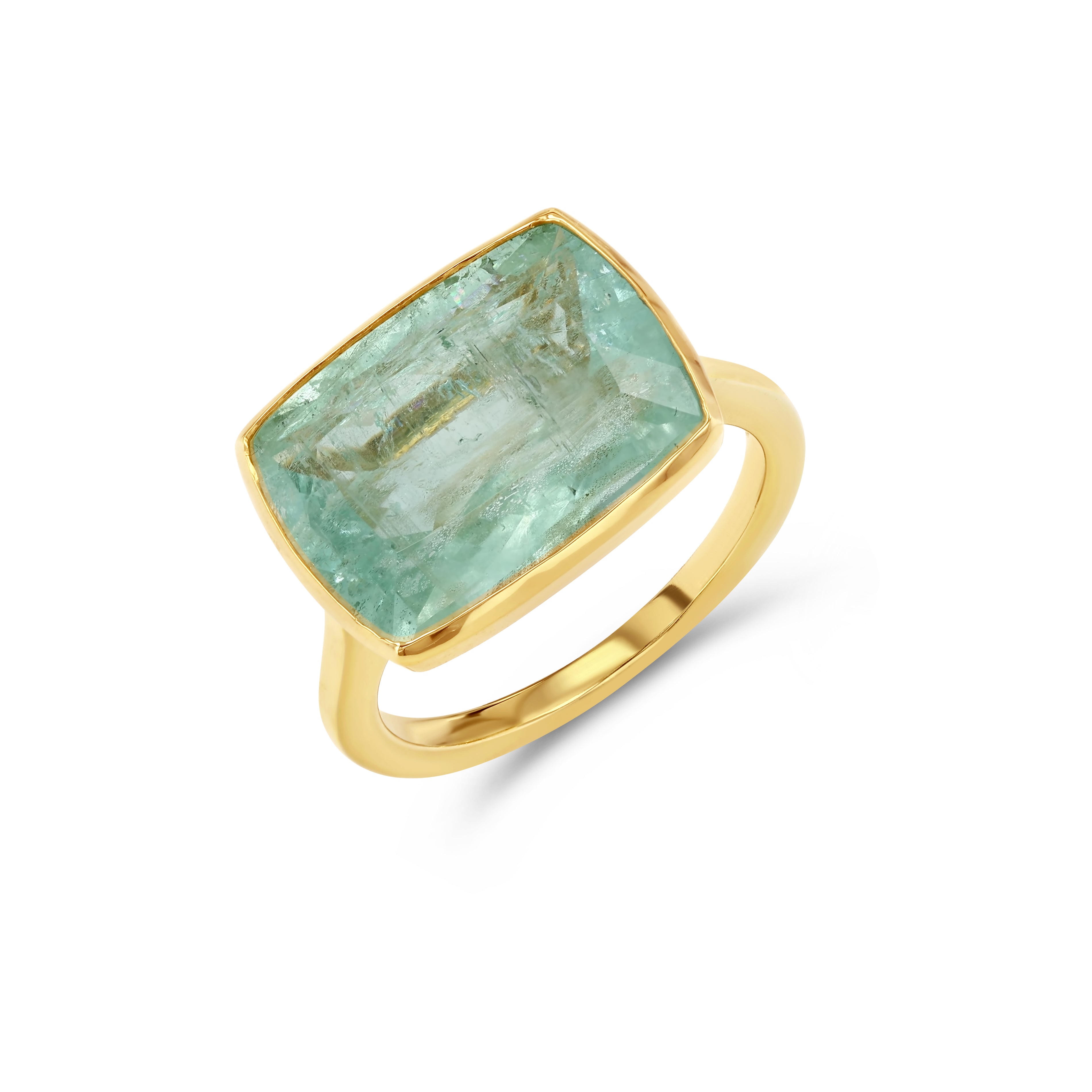 Gold ring with a large blue green beryl gemstone on a white background