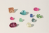 Collection of various colored gemstones on a light background