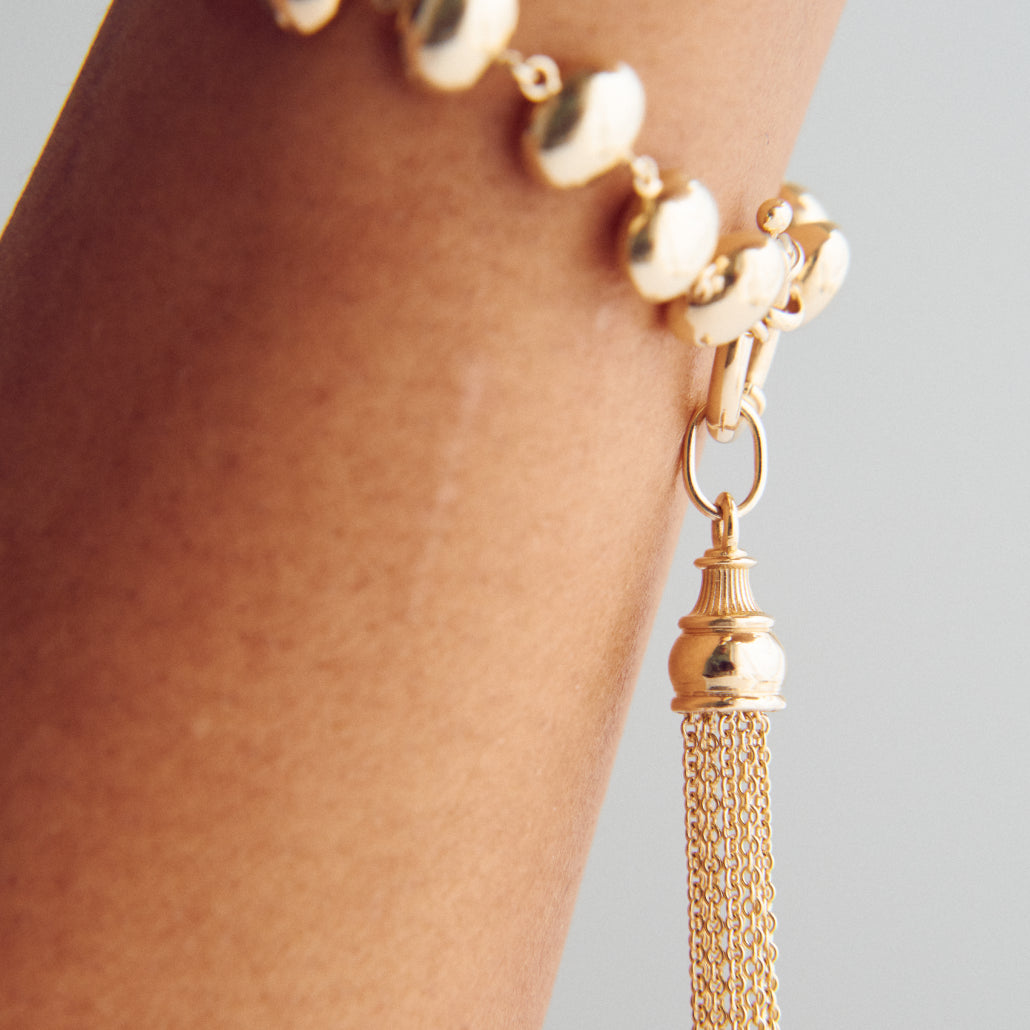 GOLDEN TASSEL CHARM