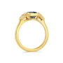 Gold ring with blue gemstone on a white background