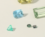 Collection of various gemstones on a light background
