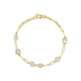Gold bracelet with clear gemstones on a white background