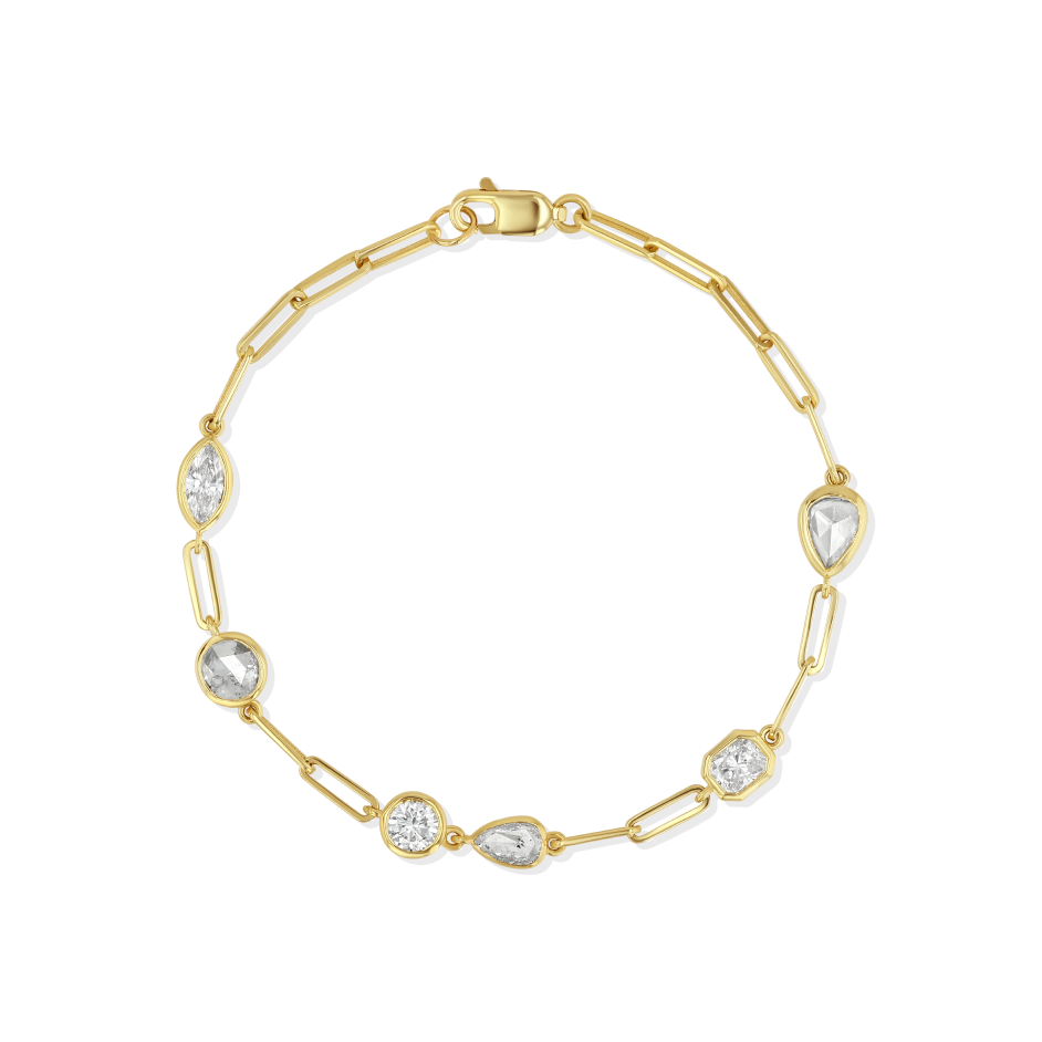 Gold bracelet with clear gemstones on a white background