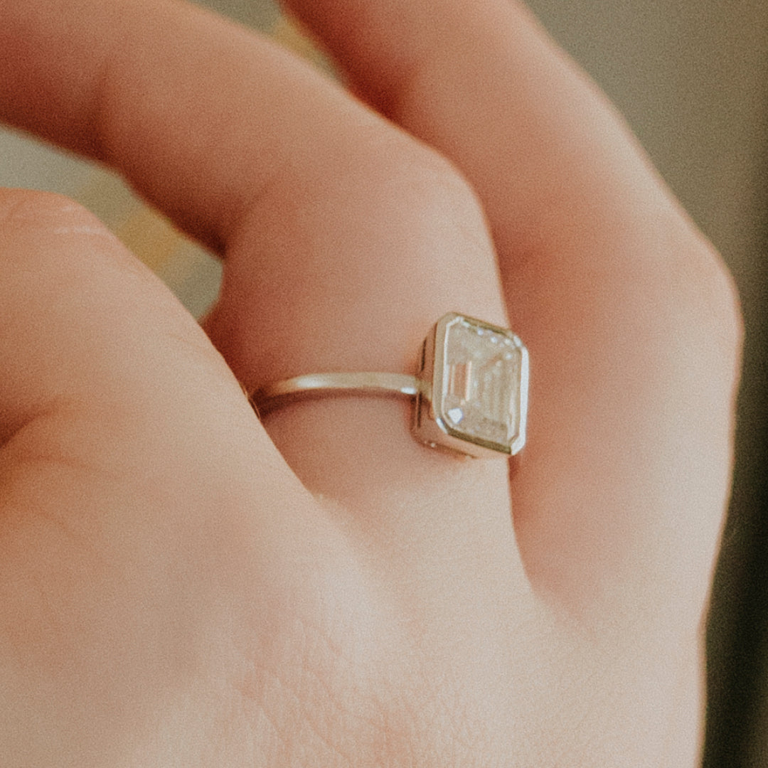 DIAMOND EMERALD CUT BEZEL SET RING