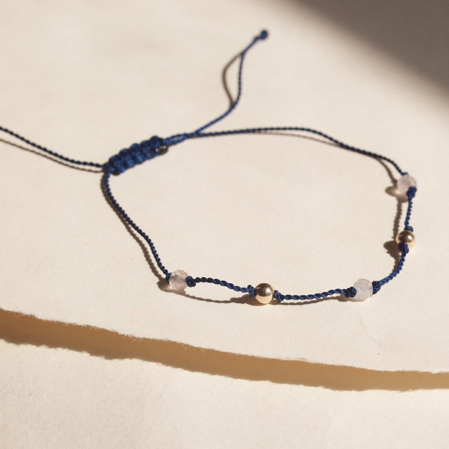 Blue string + rose quartz and gold beads bracelet